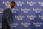 MIAMI, FL - JUNE 12:  LeBron James #6 of the Miami Heat walks into the interview room to answer questions after the Heat were defeated 105-95 by the Dallas Mavericks in Game Six of the 2011 NBA Finals at American Airlines Arena on June 12, 2011 in Miami, Florida. NOTE TO USER: User expressly acknowledges and agrees that, by downloading and/or using this Photograph, user is consenting to the terms and conditions of the Getty Images License Agreement.  (Photo by Mike Ehrmann/Getty Images)