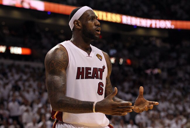MIAMI, FL - JUNE 12:  LeBron James #6 of the Miami Heat reacts against the Dallas Mavericks in Game Six of the 2011 NBA Finals at American Airlines Arena on June 12, 2011 in Miami, Florida. NOTE TO USER: User expressly acknowledges and agrees that, by downloading and/or using this Photograph, user is consenting to the terms and conditions of the Getty Images License Agreement.  (Photo by Ronald Martinez/Getty Images)