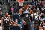 ATLANTA, GA - APRIL 24:  Dwight Howard #12 of the Orlando Magic walks downcourt after a turnover to the Atlanta Hawks during Game Four of the Eastern Conference Quarterfinals in the 2011 NBA Playoffs at Philips Arena on April 24, 2011 in Atlanta, Georgia.  NOTE TO USER: User expressly acknowledges and agrees that, by downloading and or using this photograph, User is consenting to the terms and conditions of the Getty Images License Agreement.  (Photo by Kevin C. Cox/Getty Images)