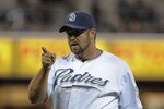 SAN DIEGO, CA-JUNE 3: Heath Bell #21 of the San Diego Padres points after getting a strike out during the ninth inning of a baseball game against the Houston Astros at Petco Park on June 3, 2011 in San Diego, California.  (Photo by Denis Poroy/Getty Images)
