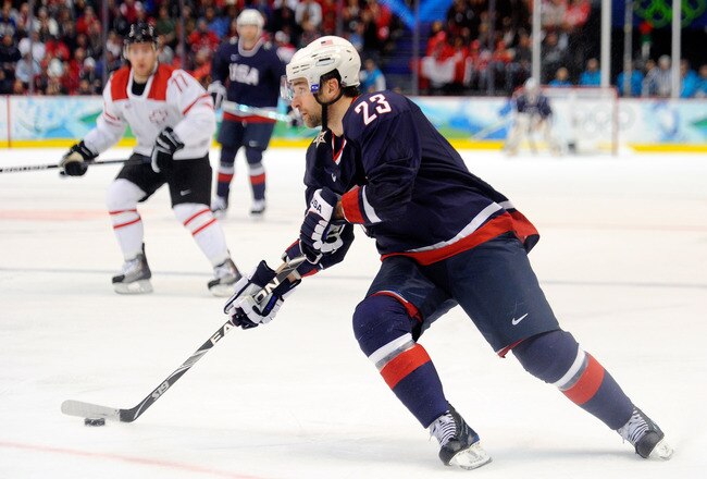 VANCOUVER, BC - FEBRUARY 24:  Chris Drury #23 of the United States handles the puck during the ice hockey men's quarter final game between USA and Switzerland on day 13 of the Vancouver 2010 Winter Olympics at Canada Hockey Place on February 24, 2010 in Vancouver, Canada.  (Photo by Kevork Djansezian/Getty Images)