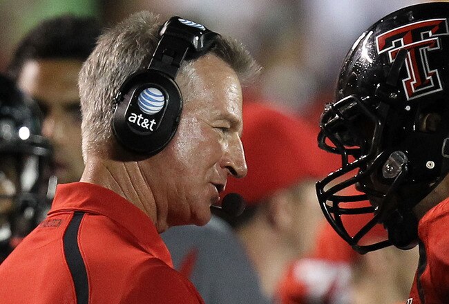 LUBBOCK, TX - SEPTEMBER 18:  Head coach Tommy Tuberville of the Texas Tech Red Raiders talks with Will Ford #7 during play against the Texas Longhorns at Jones AT&T Stadium on September 18, 2010 in Lubbock, Texas.  (Photo by Ronald Martinez/Getty Images)