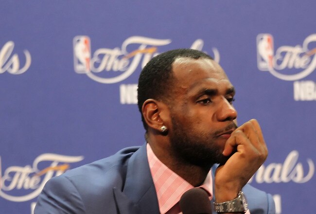 MIAMI, FL - JUNE 12:  LeBron James #6 of the Miami Heat answers questions after the Heat were defeated 105-95 by the Dallas Mavericks in Game Six of the 2011 NBA Finals at American Airlines Arena on June 12, 2011 in Miami, Florida. NOTE TO USER: User expressly acknowledges and agrees that, by downloading and/or using this Photograph, user is consenting to the terms and conditions of the Getty Images License Agreement.  (Photo by Mike Ehrmann/Getty Images)