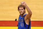 MIAMI, FL - JUNE 12:  Dirk Nowitzki #41 of the Dallas Mavericks celebrates against the Miami Heat in Game Six of the 2011 NBA Finals at American Airlines Arena on June 12, 2011 in Miami, Florida. The Mavericks won 105-95. NOTE TO USER: User expressly acknowledges and agrees that, by downloading and/or using this Photograph, user is consenting to the terms and conditions of the Getty Images License Agreement.  (Photo by Marc Serota/Getty Images)