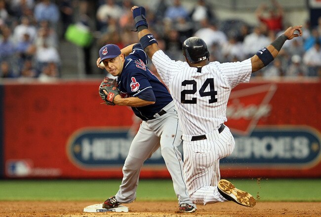 NEW YORK, NY - JUNE 13:  Robinson Cano #24 of the New York Yankees is forced out as Asdrubal Cabrera #13 of the Cleveland Indians throws to first base to complete a third inning ending double play on June 13, 2011 at Yankee Stadium in the Bronx borough of New York City.  (Photo by Jim McIsaac/Getty Images)