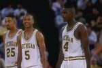 8 Mar 1992: Michigan Wolverines forward Juwan Howard, guard Jalen Rose, and forward Chris Webber (l to r) look on during a game against the Indiana Pacers.