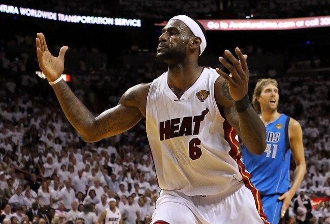 MIAMI, FL - JUNE 12:  LeBron James #6 of the Miami Heat reacts in front of Dirk Nowitzki #41 of the Dallas Mavericks in Game Six of the 2011 NBA Finals at American Airlines Arena on June 12, 2011 in Miami, Florida. NOTE TO USER: User expressly acknowledges and agrees that, by downloading and/or using this Photograph, user is consenting to the terms and conditions of the Getty Images License Agreement.  (Photo by Ronald Martinez/Getty Images)