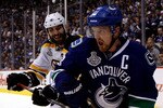 VANCOUVER, BC - JUNE 10:  Henrik Sedin #33 of the Vancouver Canucks skates against Zdeno Chara #33 of the Boston Bruins during Game Five of the 2011 NHL Stanley Cup Final at Rogers Arena on June 10, 2011 in Vancouver, British Columbia, Canada.  (Photo by Bruce Bennett/Getty Images)