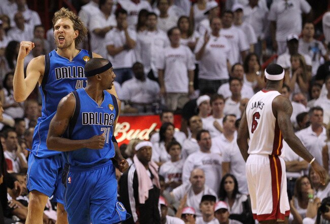 MIAMI, FL - JUNE 12:  Dirk Nowitzki #41 of the Dallas Mavericks reacts behind teammate Jason Terry #31 after Nowitzki makes a jump shot in the fourth quarter while taking on the Miami Heat in Game Six of the 2011 NBA Finals at American Airlines Arena on June 12, 2011 in Miami, Florida. NOTE TO USER: User expressly acknowledges and agrees that, by downloading and/or using this Photograph, user is consenting to the terms and conditions of the Getty Images License Agreement.  (Photo by Ronald Martinez/Getty Images)