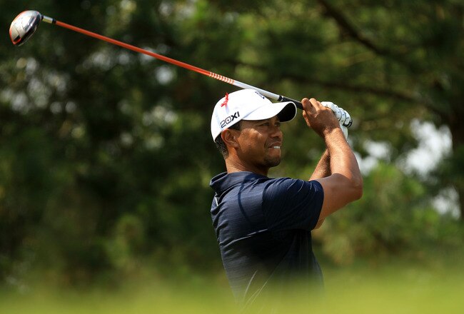 PONTE VEDRA BEACH, FL - MAY 12:  Tiger Woods hits his tee shot on the ninth hole during the first round of THE PLAYERS Championship held at THE PLAYERS Stadium course at TPC Sawgrass on May 12, 2011 in Ponte Vedra Beach, Florida.  (Photo by Streeter Lecka/Getty Images)