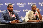 MIAMI, FL - JUNE 12:  LeBron James #6 and Dwyane Wade #3 of the Miami Heat answer questions after the Heat were defeated 105-95 by the Dallas Mavericks in Game Six of the 2011 NBA Finals at American Airlines Arena on June 12, 2011 in Miami, Florida. NOTE TO USER: User expressly acknowledges and agrees that, by downloading and/or using this Photograph, user is consenting to the terms and conditions of the Getty Images License Agreement.  (Photo by Mike Ehrmann/Getty Images)