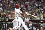 PHOENIX, AZ - JUNE 14:  Justin Upton #10 of the Arizona Diamondbacks hits a single against the San Francisco Giants during the fourth inning of the Major League Baseball game at Chase Field on June 14, 2011 in Phoenix, Arizona.  (Photo by Christian Petersen/Getty Images)