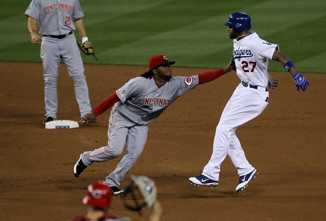 LOS ANGELES, CA - JUNE 14:  Pitcher Johnny Cueto #47 of the Cincinnati Reds tags out Matt Kemp #27 the Los Angeles Dodgers after Kemp was caught in a rundown between first and second on his single in the fourth inning on June 14, 2011 at Dodger Stadium in Los Angeles, California.  (Photo by Stephen Dunn/Getty Images)