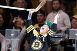 BOSTON, MA - JUNE 13:  ]A Boston Bruins fan celebrates after receiving a stick signed by Michael Ryder (not pictured) #73 of the Boston Bruins after they defeated the Vancouver Canucks in Game Six of the 2011 NHL Stanley Cup Final at TD Garden on June 13, 2011 in Boston, Massachusetts. The Boston Bruins defeated the Vancouver Canucks 5 to 2.  (Photo by Elsa/Getty Images)
