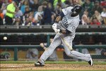 DETROIT, MI - JUNE 10:  Right Fielder Carlos Peguero #8 of the Seattle Mariners hits this seventh inning pitch for a solo home run during a MLB game against the Detroit Tigers at Comerica Park on June 10, 2011 in Detroit, Michigan.  Seattle defeated Detroit 3-2.  (Photo by Dave Reginek/Getty Images)