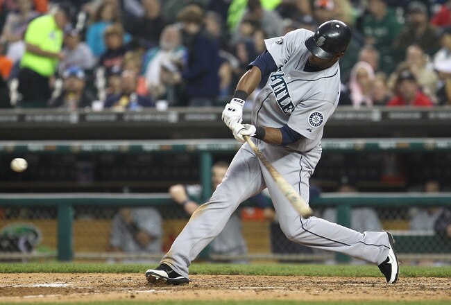DETROIT, MI - JUNE 10:  Right Fielder Carlos Peguero #8 of the Seattle Mariners hits this seventh inning pitch for a solo home run during a MLB game against the Detroit Tigers at Comerica Park on June 10, 2011 in Detroit, Michigan.  Seattle defeated Detroit 3-2.  (Photo by Dave Reginek/Getty Images)