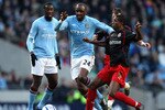 MANCHESTER, ENGLAND - MARCH 13:  Patrick Vieira of Manchester City is tackled by Mikele Leigertwood of Reading during the FA Cup sponsored by E.On Sixth Round match between Manchester City and Reading at the City of Manchester Stadium on March 13, 2011 in Manchester, England.  (Photo by Ian Walton/Getty Images)