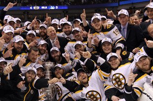 VANCOUVER, BC - JUNE 15:  The Boston Bruins pose with the Stanley Cup after defeating the Vancouver Canucks in Game Seven of the 2011 NHL Stanley Cup Final at Rogers Arena on June 15, 2011 in Vancouver, British Columbia, Canada. The Boston Bruins defeated the Vancouver Canucks 4 to 0.  (Photo by Bruce Bennett/Getty Images)
