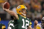 ARLINGTON, TX - FEBRUARY 06:  Aaron Rodgers #12 of the Green Bay Packers throws a pass against the Pittsburgh Steelers during Super Bowl XLV at Cowboys Stadium on February 6, 2011 in Arlington, Texas.  (Photo by Ronald Martinez/Getty Images)