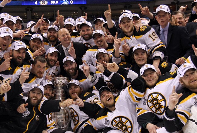 VANCOUVER, BC - JUNE 15:  The Boston Bruins pose with the Stanley Cup after defeating the Vancouver Canucks in Game Seven of the 2011 NHL Stanley Cup Final at Rogers Arena on June 15, 2011 in Vancouver, British Columbia, Canada. The Boston Bruins defeated the Vancouver Canucks 4 to 0.  (Photo by Bruce Bennett/Getty Images)