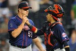 KANSAS CITY, MO - JUNE 2:  Matt Capps #55 of the Minnesota Twins is congratulated by catcher Rene Rivera #32 following a win against the Kansas City Royals at Kauffman Stadium on June 2, 2011 in Kansas City, Missouri. The Twins defeated the Royals 8-2. (Photo by G. Newman Lowrance/Getty Images)