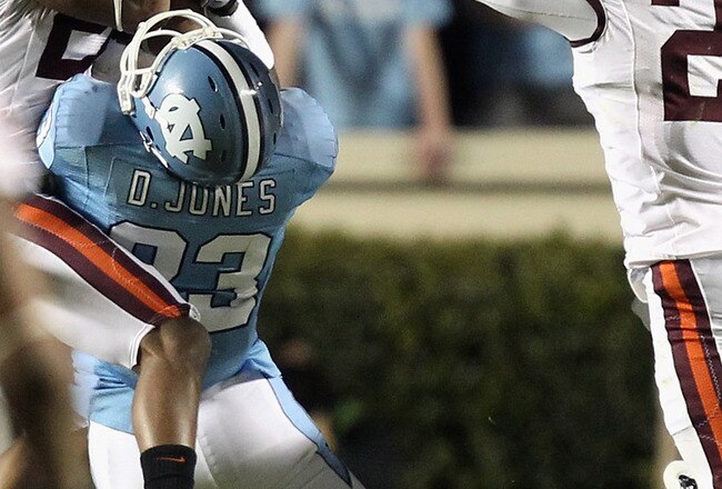 CHAPEL HILL, NC - NOVEMBER 13:  Jayron Hosley #20 of the Virginia Tech Hokies makes an interception as teammate Rashad Carmichael #21 watches on with Dwight Jones #83 of the North Carolina Tar Heels during their game at Kenan Stadium on November 13, 2010 in Chapel Hill, North Carolina.  (Photo by Streeter Lecka/Getty Images)