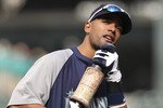 SEATTLE - JUNE 15:  Franklin Gutierrez #21 of the Seattle Mariners uses his bat as a faux microphone as he sings along with music played over the public address system during batting practice prior to the game against the Los Angeles Angels of Anaheim at Safeco Field on June 15, 2011 in Seattle, Washington. (Photo by Otto Greule Jr/Getty Images)