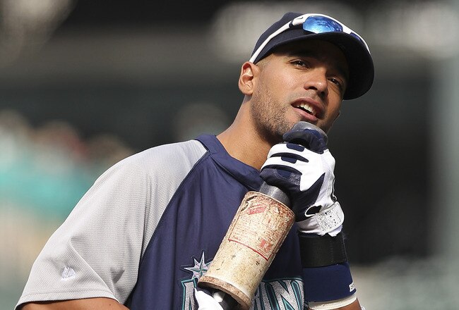 SEATTLE - JUNE 15:  Franklin Gutierrez #21 of the Seattle Mariners uses his bat as a faux microphone as he sings along with music played over the public address system during batting practice prior to the game against the Los Angeles Angels of Anaheim at Safeco Field on June 15, 2011 in Seattle, Washington. (Photo by Otto Greule Jr/Getty Images)