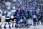 VANCOUVER, BC - MAY 24:  Captain Henrik Sedin #33 of the Vancouver Canucks shakes hands with Joe Pavelski #8 of the San Jose Sharks after the Vancouver Canucks won Game Five of the Western Conference Finals 3-2 in the second overtime to win the series 4-1 during the 2011 Stanley Cup Playoffs at Rogers Arena on May 24, 2011 in Vancouver, British Columbia, Canada.  (Photo by Rich Lam/Getty Images)