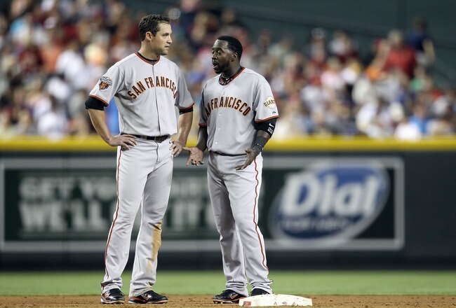 PHOENIX, AZ - JUNE 15:  Bill Hall #6 of the San Francisco Giants reacts as he talks with Pat Burrell #5 after he was called out on a double play during the sixth inning of the Major League Baseball game against the Arizona Diamondbacks at Chase Field on June 15, 2011 in Phoenix, Arizona.  (Photo by Christian Petersen/Getty Images)