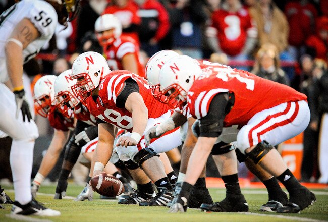 LINCOLN, NE - NOVEMBER 26: Mike Caputo #58 of the Nebraska Cornhuskers and the rest of the Nebraska offensive line powered their way past the Colorado Buffaloes during their game at Memorial Stadium on November 26, 2010 in Lincoln, Nebraska. Nebraska defeated Colorado 45-17 (Photo by Eric Francis/Getty Images)