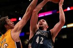 LOS ANGELES - NOVEMBER 9: Kevin Love #42 of the Minnesota Timberwolves shoots over Pau Gasol #16 of the Los Angeles Lakers at Staples Center on November 9, 2010 in Los Angeles, California. The Lakers won 99-94.   NOTE TO USER: User expressly acknowledges and agrees that, by downloading and or using this photograph, User is consenting to the terms and conditions of the Getty Images License Agreement. (Photo by Stephen Dunn/Getty Images)