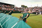 WIMBLEDON, ENGLAND - JUNE 29:  Covers are pulled across as the rain moves in on Day Seven of the Wimbledon Lawn Tennis Championships at the All England Lawn Tennis and Croquet Club on June 29, 2009 in London, England.  (Photo by Ian Walton/Getty Images)
