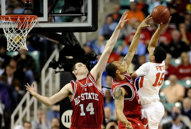 GREENSBORO, NC - MARCH 11:  David Potter #15 of the Clemson Tigers shoots over Jordan Vandenberg #14 and Julius Mays #24 of the NC State Wolfpack in their first round game in the 2010 ACC Men's Basketball Tournament at the Greensboro Coliseum on March 11, 2010 in Greensboro, North Carolina.  (Photo by Jeff Zelevansky/Getty Images)