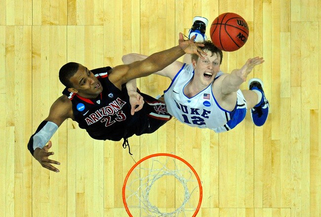 ANAHEIM, CA - MARCH 24:  Derrick Williams #23 of the Arizona Wildcats fights for a rebound against Kyle Singler #12 of the Duke Blue Devils during the west regional semifinal of the 2011 NCAA men's basketball tournament at the Honda Center on March 24, 2011 in Anaheim, California.  (Photo by Kevork Djansezian/Getty Images)