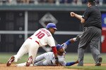 PHILADELPHIA, PA - MAY 22: Elvis Andrus #1 of the Texas Rangers tags out Ben Francisco #10 of the Philadelphia Phillies during a play at second base at Citizens Bank Park on May 22, 2011 in Philadelphia, Pennsylvania. The Rangers won 2-0. (Photo by Joe Robbins/Getty Images)