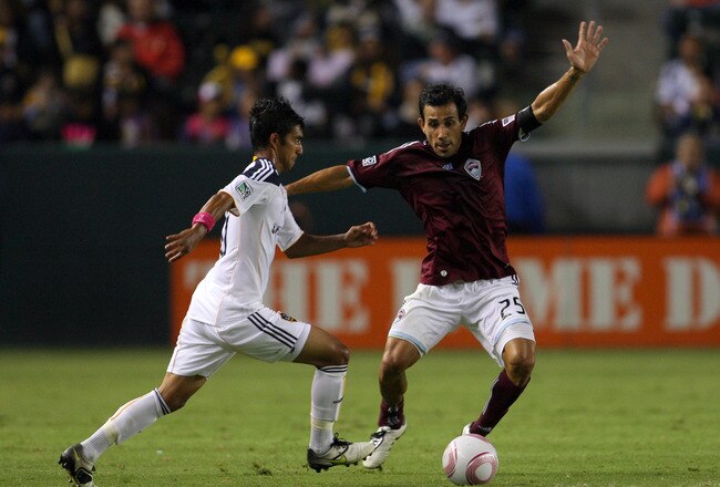 CARSON, CA - OCTOBER 16:  Pablo Mastroeni #25 of the Colorado Rapids defends A.J. DeLaGarza #20 of the Los Angeles Galaxy during the MLS match at The Home Depot Center on October 16, 2010 in Carson, California. The Rapids defeated the Galaxy 3-1.  (Photo by Victor Decolongon/Getty Images)