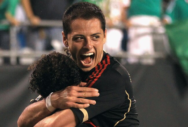 CHARLOTTE, NC - JUNE 09:  Javier Hernandez celebrates with teammate Giovani Dos Santos #10 of Mexico after Dos Santos scored a goal against Cuba during their game in the CONCACAF Gold Cup at Bank of America Stadium on June 9, 2011 in Charlotte, North Carolina.  (Photo by Streeter Lecka/Getty Images)