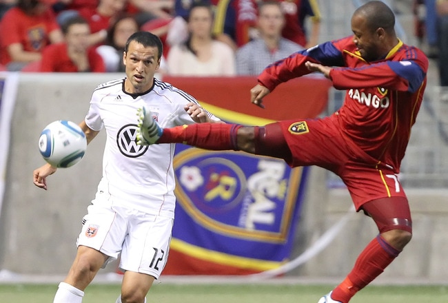 SANDY, UT - JUNE 18: Andy Williams #77 of Real Salt Lake kicks the ball as Jed Zayner #12 of DC United looks on during the second half of an MLS soccer game June 18, 2011 at Rio Tinto Stadium in Sandy, Utah. Real Salt Lake and DC United played to a 1-1 tie. (Photo by George Frey/Getty Images)