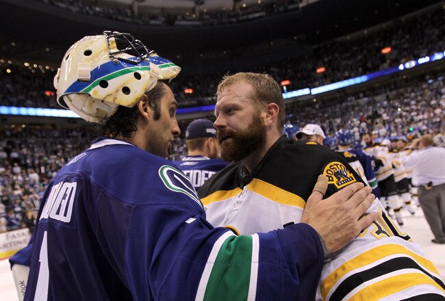 VANCOUVER, BC - JUNE 15:  Roberto Luongo (L) #1 of the Vancouver Canucks congratulates Tim Thomas #30 of the Boston Bruins after defeating the Vancouver Canucks in Game Seven of the 2011 NHL Stanley Cup Final at Rogers Arena on June 15, 2011 in Vancouver, British Columbia, Canada. The Boston Bruins defeated the Vancouver Canucks 4 to 0.  (Photo by Bruce Bennett/Getty Images)