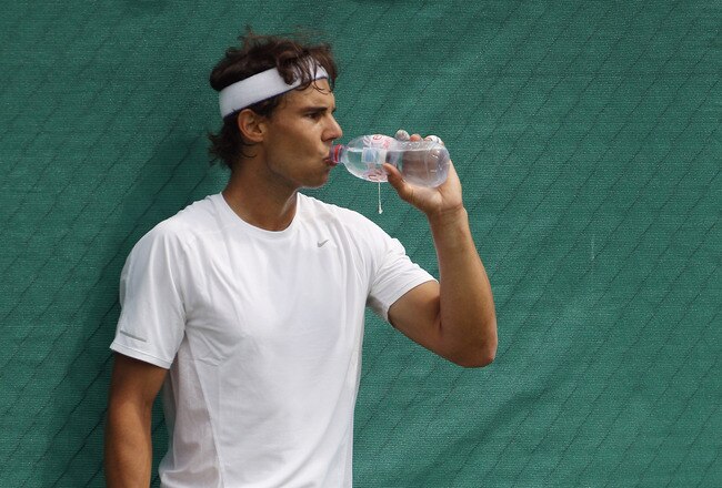 WIMBLEDON, ENGLAND - JUNE 18:   Rafael Nadal of Spain trains on the Aorangi Practice court at the All England Lawn Tennis and Croquet Club ahead of the Wimbledon Lawn Tennis Championships on June 18, 2011 in London, England. The Championships, which are celebrating their 125th anniversary this year, begin on June 20.  (Photo by Oli Scarff/Getty Images)