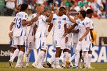 EAST RUTHERFORD, NJ - JUNE 18:  Jerry Bengtson #9 of Honduras is mobbed by his teammates after scoring the clinching penalty kick against Costa Rica during the 2011 Gold Cup Quarterfinals on June 18, 2011 at the New Meadowlands Stadium in East Rutherford, New Jersey  (Photo by Mike Stobe/Getty Images)