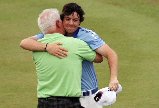 BETHESDA, MD - JUNE 19:  Rory McIlroy of Northern Ireland (R) celebrates his eight-stroke victory with his father Gerry McIlroy (L) on the 18th green during the 111th U.S. Open at Congressional Country Club on June 19, 2011 in Bethesda, Maryland.  (Photo by Ross Kinnaird/Getty Images)
