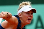 PARIS, FRANCE - MAY 27:  Caroline Wozniacki of Denmark serves during the women's singles round three match between Caroline Wozniacki of Denmark and Daniela Hantuchova of Slovakia on day six of the French Open at Roland Garros on May 27, 2011 in Paris, France.  (Photo by Clive Brunskill/Getty Images)