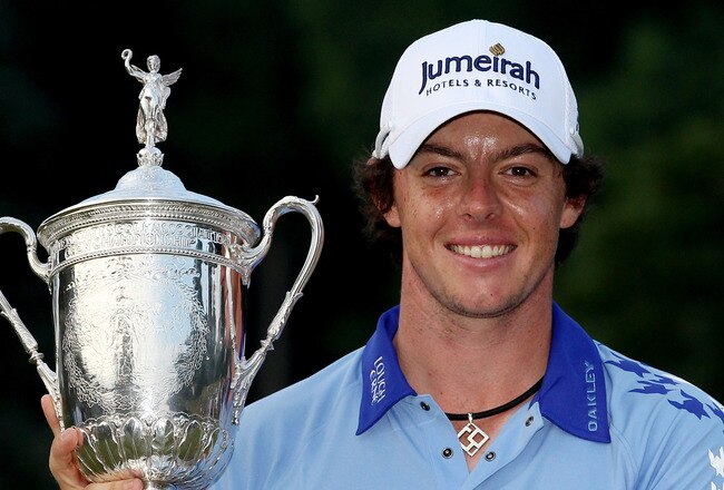 BETHESDA, MD - JUNE 19:  Rory McIlroy of Northern Ireland poses with the trophy after his eight-stroke victory on the 18th green during the 111th U.S. Open at Congressional Country Club on June 19, 2011 in Bethesda, Maryland.  (Photo by Andrew Redington/Getty Images)