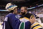 VANCOUVER, BC - JUNE 15:  Roberto Luongo (L) #1 of the Vancouver Canucks congratulates Tim Thomas #30 of the Boston Bruins after defeating the Vancouver Canucks in Game Seven of the 2011 NHL Stanley Cup Final at Rogers Arena on June 15, 2011 in Vancouver, British Columbia, Canada. The Boston Bruins defeated the Vancouver Canucks 4 to 0.  (Photo by Bruce Bennett/Getty Images)