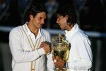 LONDON - JULY 06:  Roger Federer of Switzerland congratulates Rafael Nadal of Spain in winning the Championship trophy during the men's singles Final on day thirteen of the Wimbledon Lawn Tennis Championships at the All England Lawn Tennis and Croquet Club on July 6, 2008 in London, England.  (Photo by Julian Finney/Getty Images)