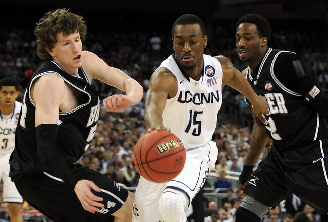 HOUSTON, TX - APRIL 04:  Kemba Walker #15 of the Connecticut Huskies fights for the ball against Matt Howard #54 and Shawn Vanzant #2 of the Butler Bulldogs during the National Championship Game of the 2011 NCAA Division I Men's Basketball Tournament at Reliant Stadium on April 4, 2011 in Houston, Texas.  (Photo by Pool/Getty Images)