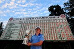 BETHESDA, MD - JUNE 19:  Rory McIlroy of Northern Ireland poses with the trophy after his eight-stroke victory on the 18th green during the 111th U.S. Open at Congressional Country Club on June 19, 2011 in Bethesda, Maryland.  (Photo by David Cannon/Getty Images)
