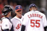 CLEVELAND, OH - JUNE 20:  Pitching Coach Tim Belcher #49 of the Cleveland Indians talks with pitcher Fausto Carmona #55 of the Cleveland Indians with catcher Lou Marson #6 of the Cleveland Indians during a game against the Colorado Rockies at Progressive Field on June 20, 2011 in Cleveland, Ohio. Colorado defeated Cleveland 8-7.   (Photo by Jamie Sabau/Getty Images)
